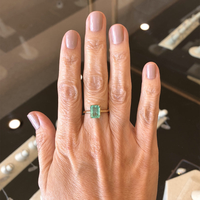 My push present after 2 kids in 2 years - I'm in love! Size 8 4.75 CT  Emerald three-stone in 10k yellow gold worn with my diamond wedding band.  From MoissaniteCo : r/Moissanite
